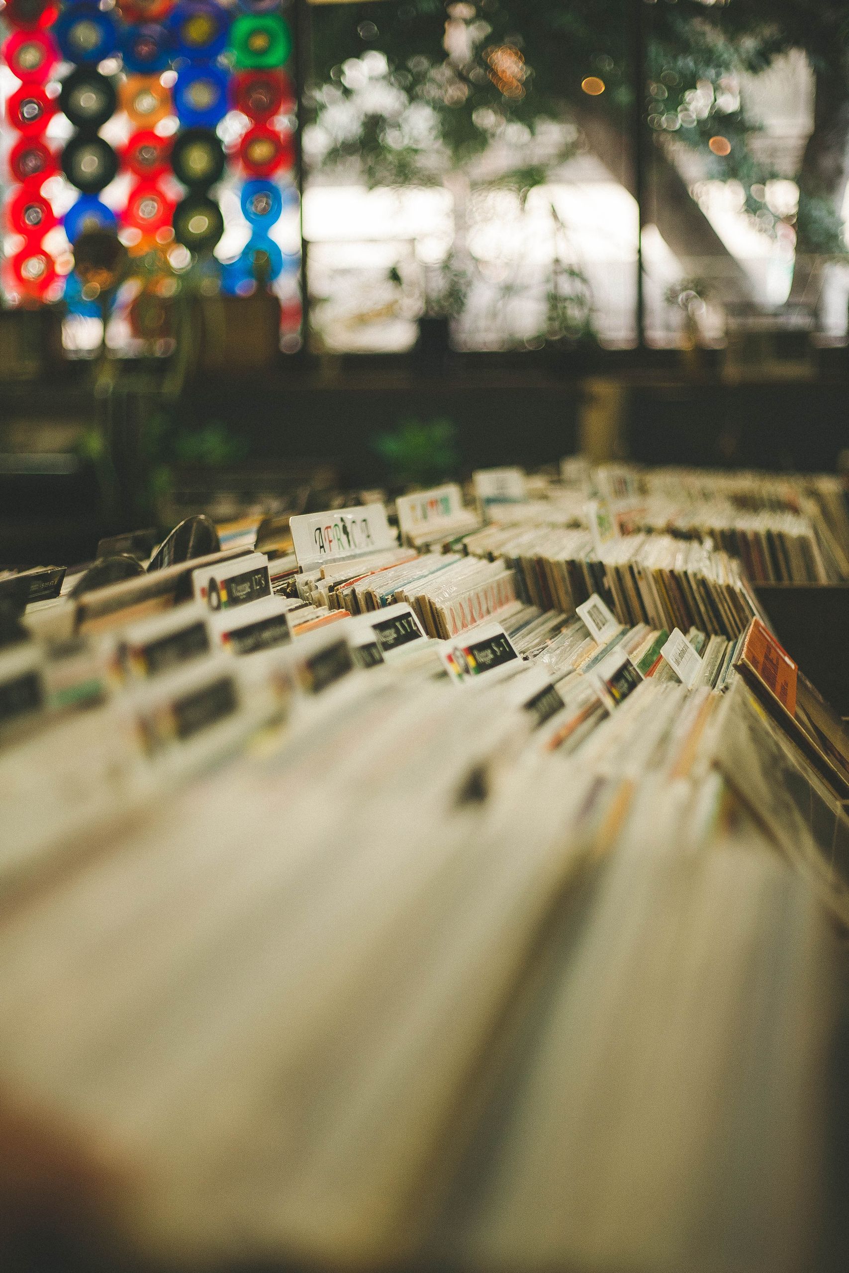 A cozy vintage record store displaying rows of vinyl records and retro decor, evoking a nostalgic feel.