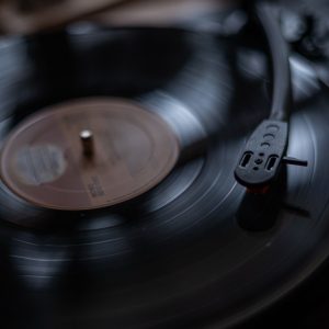 Close-up of a spinning vinyl record on a vintage turntable. Perfect for music and nostalgia themes.